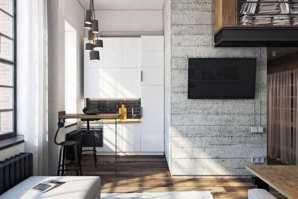 Khu bếp nấu rất nhỏ được tích hợp cùng hệ tủ nhiều ngăn cao sát trần. Kiểu thiết kế này giúp đảm bảo chức năng cho không gian bếp, đồng thời tạo thêm nhiều không gian lưu trữ cho nhà.